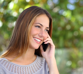 Woman on cell phone smiling